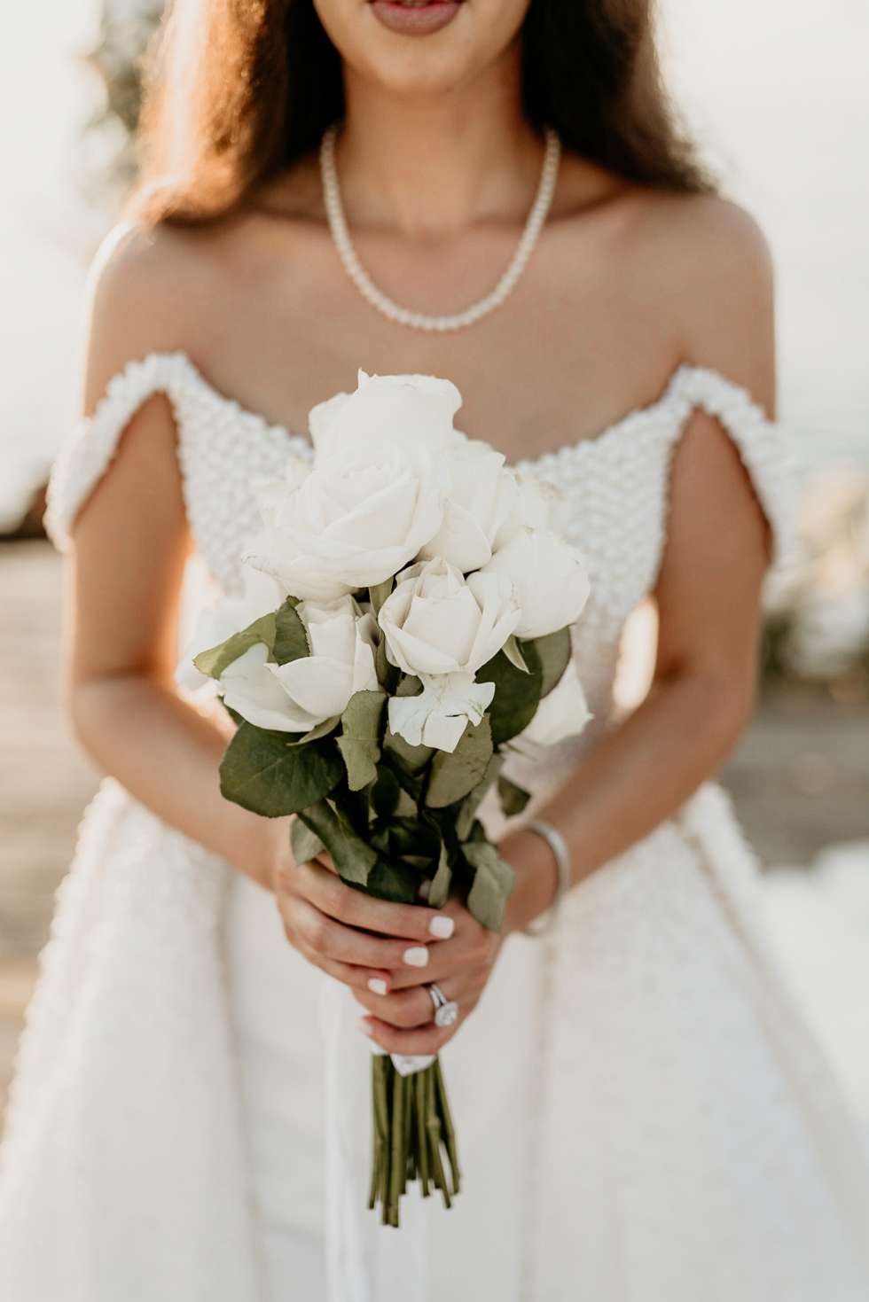 Maysoon Bastoni's white rose wedding bouquet