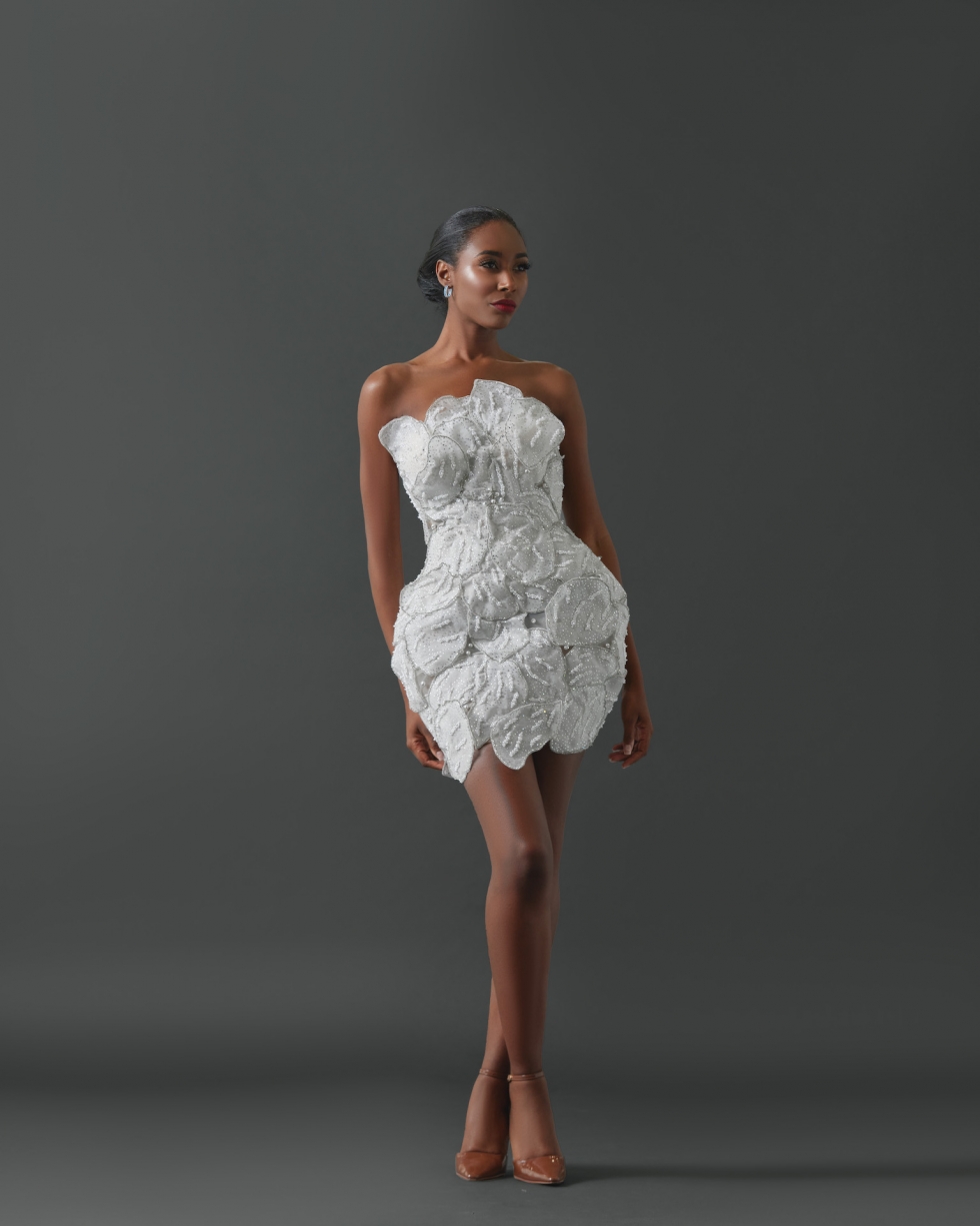 Strapless mini dress comprised of large, layered pearl and crystal encrusted petals.