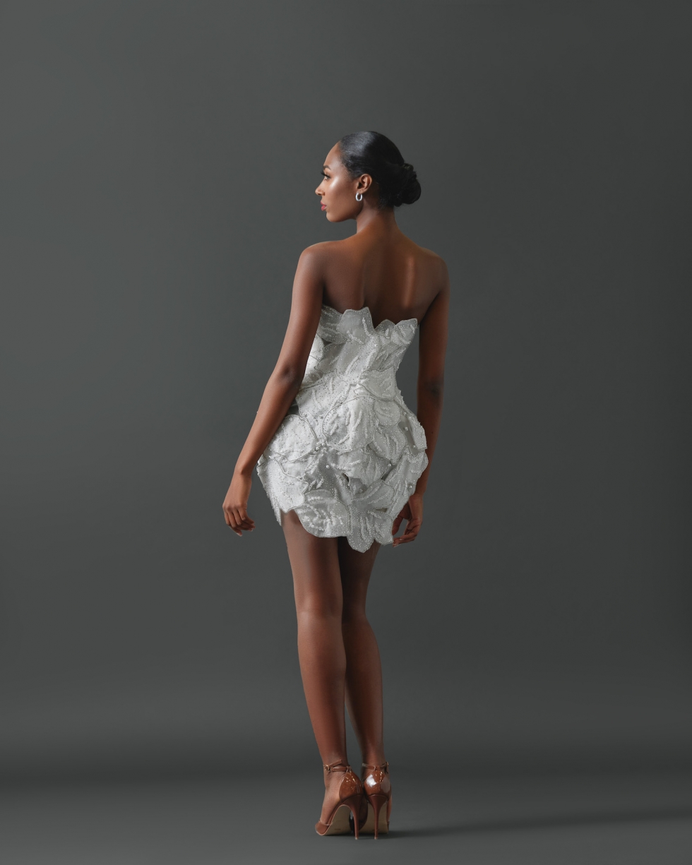 Strapless mini dress comprised of large, layered pearl and crystal encrusted petals.